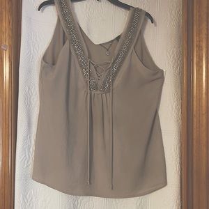 BKE Boutique Beaded  lace up v-neck flowy sheer lined blouse.